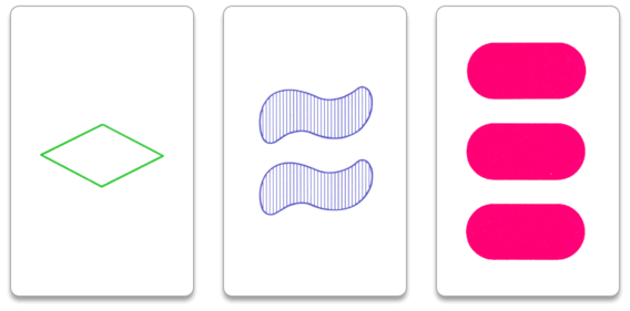 The cards have different numbers, colors, shapes, and textures, forming a set