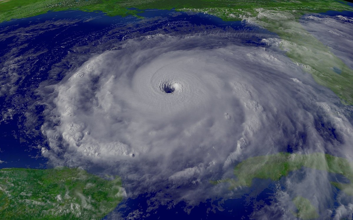 A hurricane is a weather system in which a low pressure center attracts the air around it, creating the cyclonic shape.