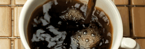 What causes a cup of coffee to settle down?