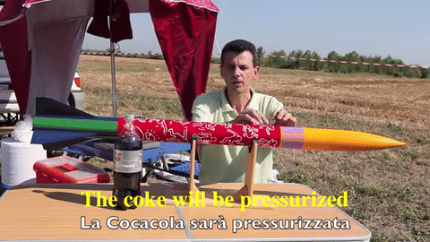 The engineer explains that the yellow nose cap is full of mentos, while the body is full of pressurized diet coke.
