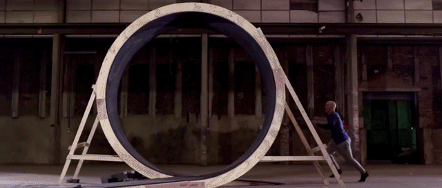 This person must run fast enough that the centripetal acceleration is greater than the gravitational acceleration at the top of the loop, or else gravity will pull them down on their head.