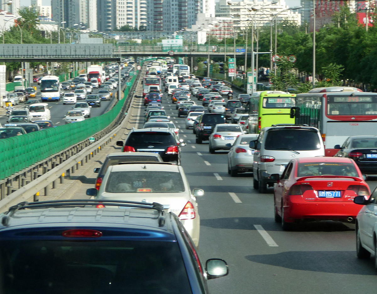 Continuity explains why traffic moves slower before a bottleneck than during the bottleneck. Wikimedia